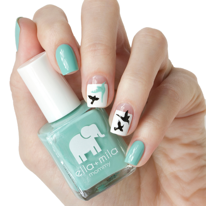Don't Be Blue turquoise nail polish with white and black bow accent nail art