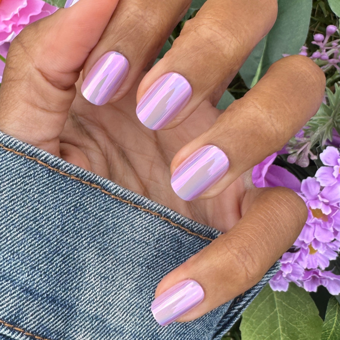 Lavender Chrome - Press-On | Short | Squoval showing short squoval nails with shiny lavender chrome manicure on natural hand