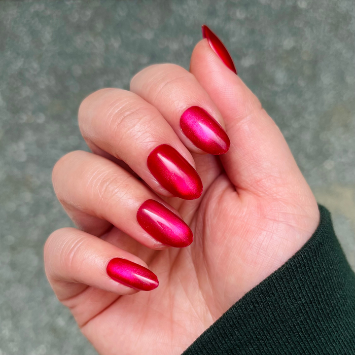Magenta Velvet - Press-On | Medium | Oval showing hand with medium oval magenta velvet press-on nails in natural light