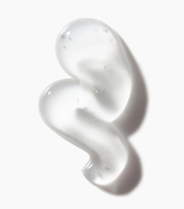 Not Your Mothers clear gel smear on white background showing frizz control sculpting gel texture and shine