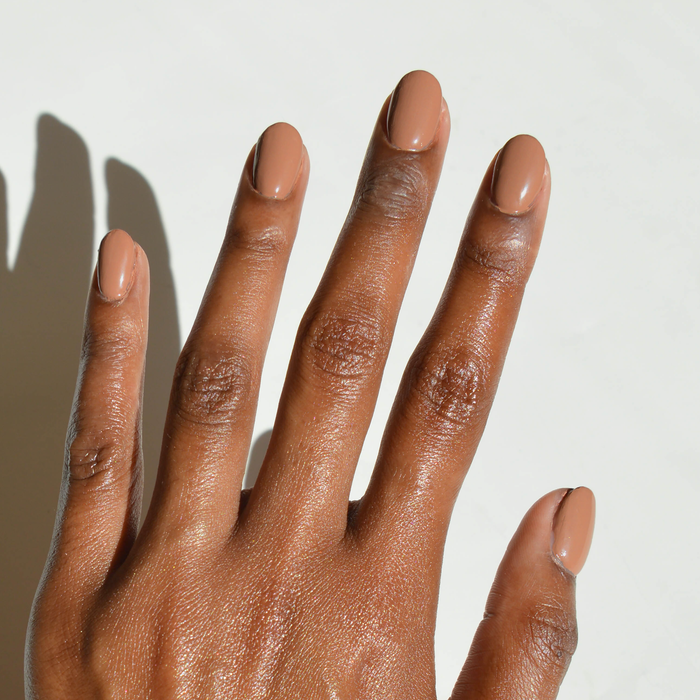 11th Hour creamy mocha brown nail polish manicure on a deep skin tone