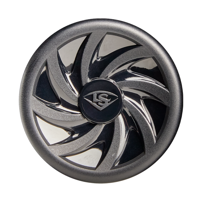A metallic, circular object with a black center engraved with the Louisville Slugger logo. Its outer edge mirrors the swirling, reflective blade design of the 2026 Louisville Slugger Atlas (-12.5) T-Ball Bat against a white background.
