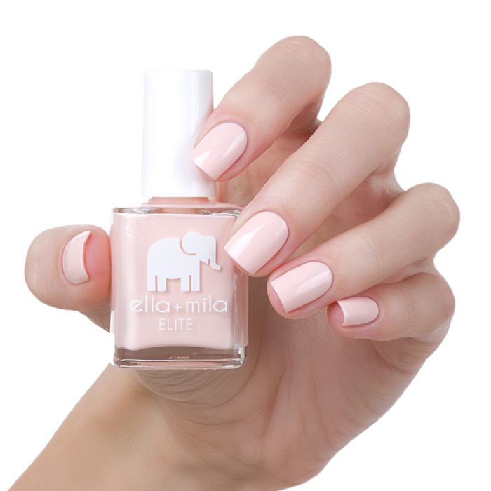 Barefoot nude pink nail polish manicure on a light skin tone with the bottle