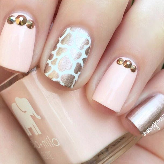 Barefoot nude pink nail polish with gold stud and metallic accent nail art