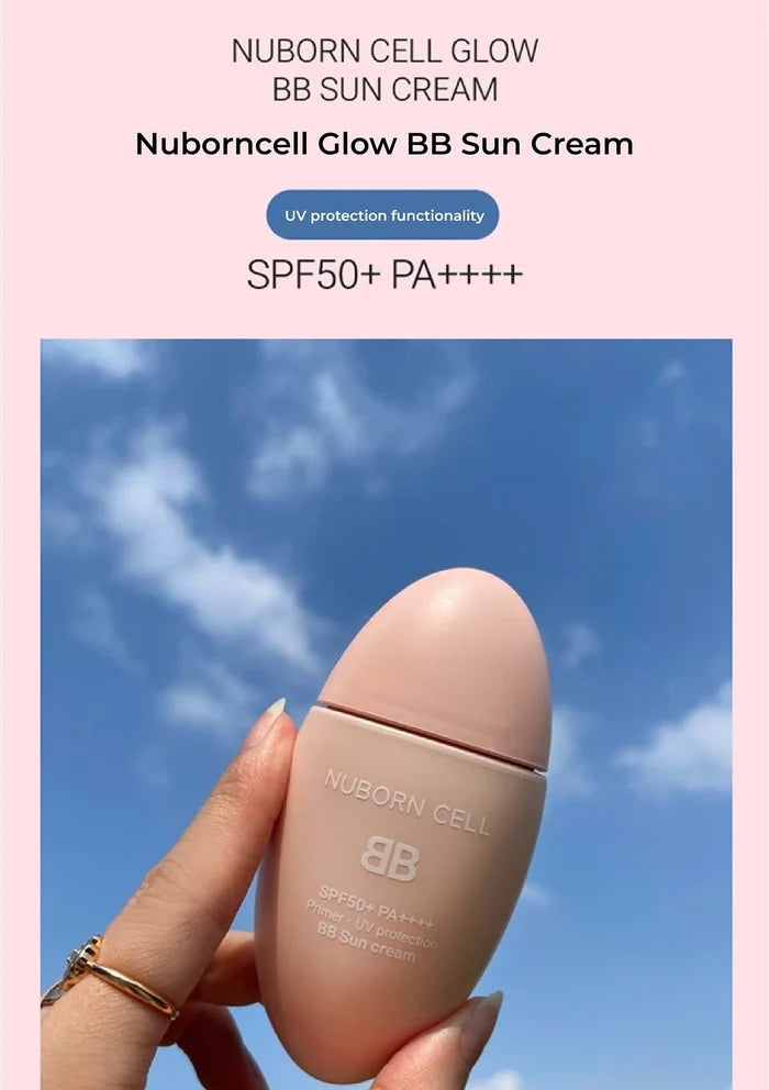 Nuborn Cell Glow BB Sun Cream held against a blue sky