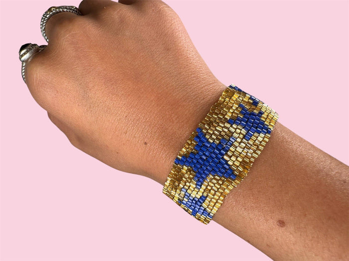 Blue and gold Camel Threads game day adult bracelet with beads and adjustable cord for sports fan accessories.