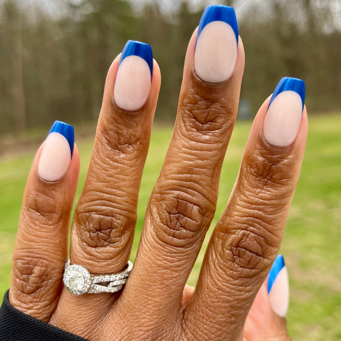 Blue Metallic French - Press-On | Medium | Coffin showcasing hand with medium coffin false nails and metallic blue French tips outdoors