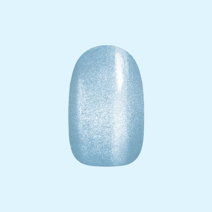 Blue Velvet - Press-On | Extra Short | Round showing single extra short round press-on nail with soft blue velvet texture on pale background