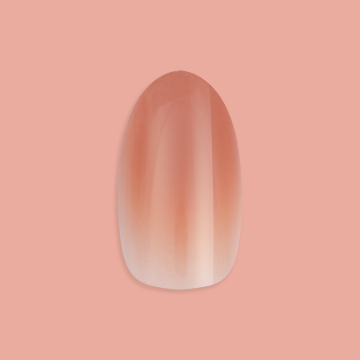 Caramel Syrup Gradient - Press-On | Medium | Oval showing single false nail with warm brown gradient manicure polish