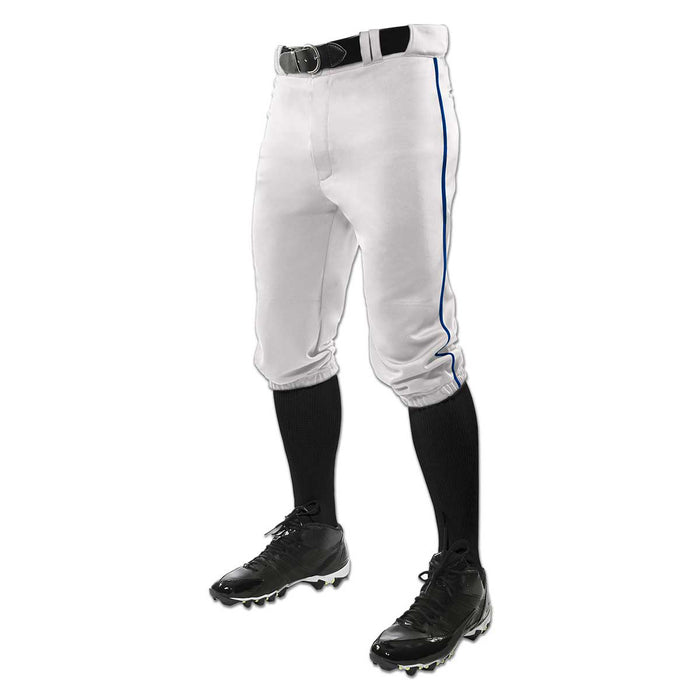 A person wearing Champro Sports Youth Triple Crown Knicker Baseball Pants with Piping (BP101Y), black belt, black knee-high socks, and black cleats, shown from the waist down against a white background.