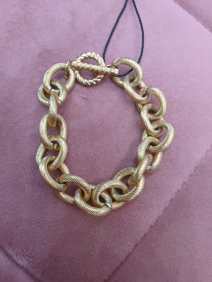 Mia Accessories chunky chain link bracelet with large interconnected metal links on a neutral background