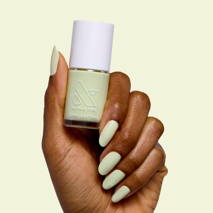 Corrigan mint pastel green polish on almond nails for a smooth, long-lasting mani by Olive and June at home