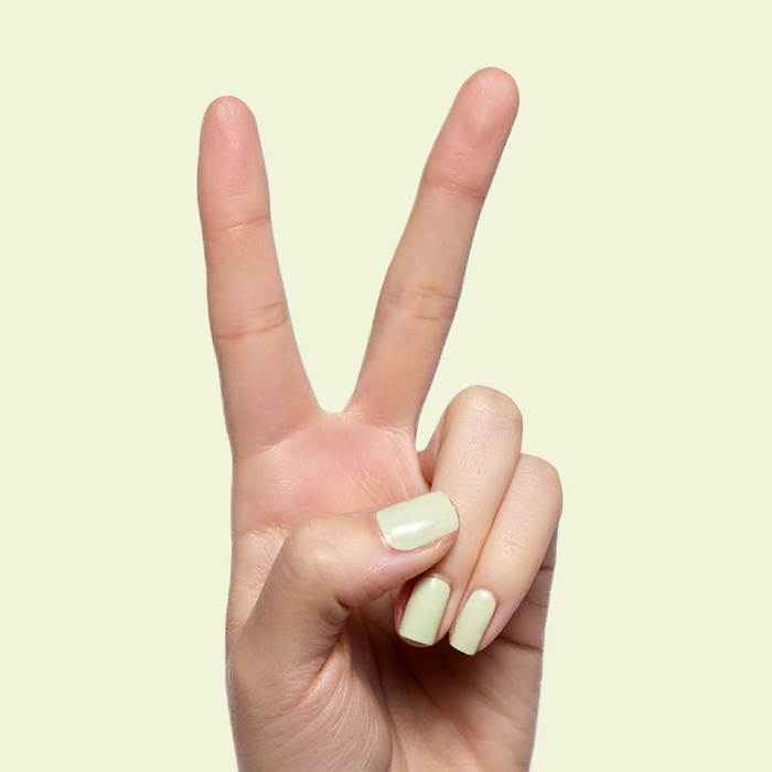 Corrigan mint pastel green polish on short nails for a smooth, quick dry at-home manicure by Olive and June