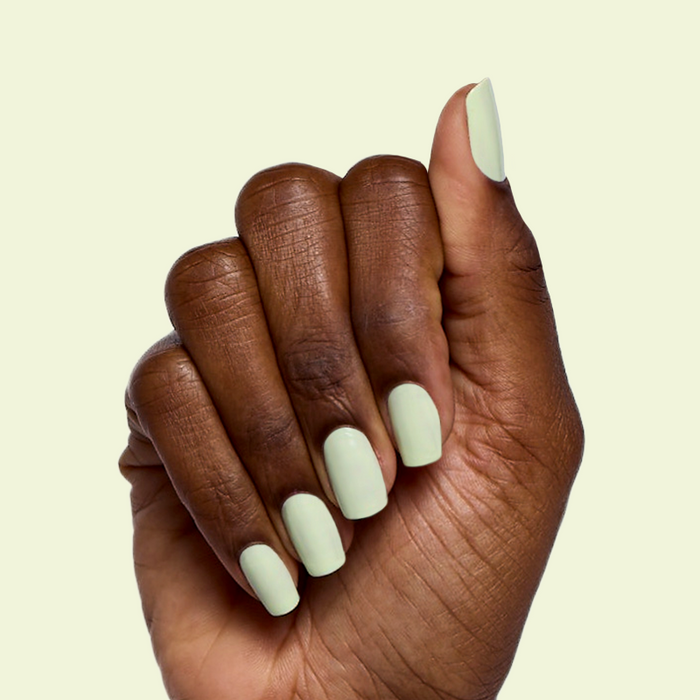 Corrigan mint pastel green polish on medium-length nails with a smooth finish for an easy at-home manicure by Olive and June