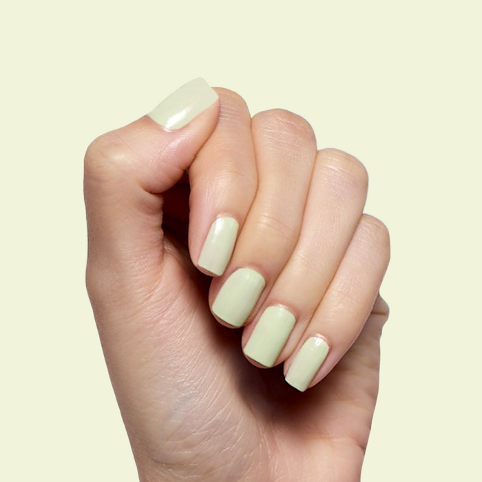 Corrigan mint pastel green polish on medium-length nails with a smooth finish for an easy at-home manicure by Olive and June