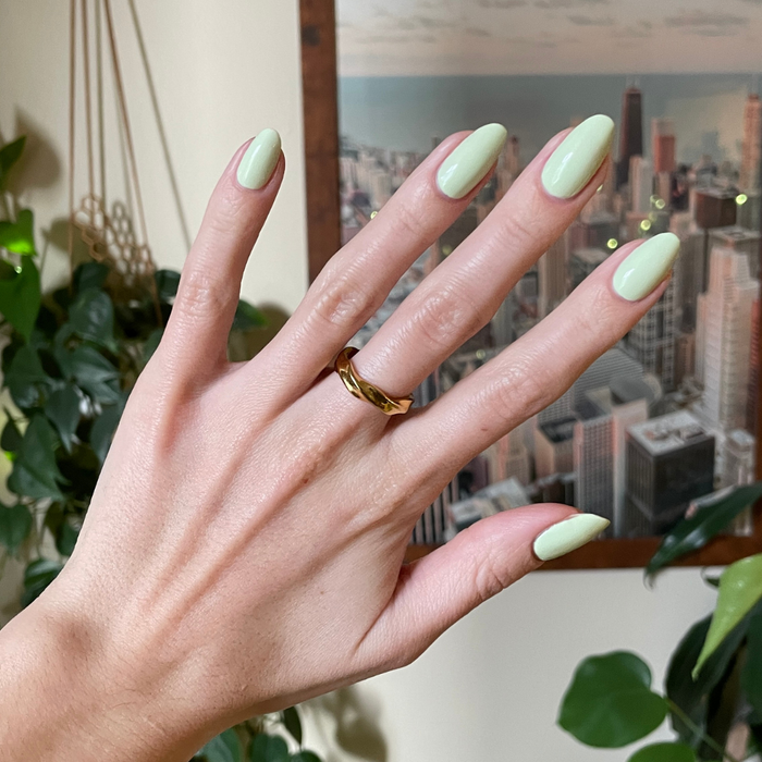 Corrigan mint pastel green polish on neatly shaped nails with a smooth finish for an easy at-home manicure by Olive and June