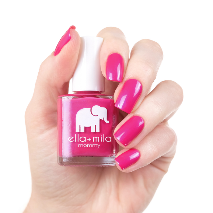 Cosmo Pink hot pink nail polish manicure on a light skin tone with the bottle