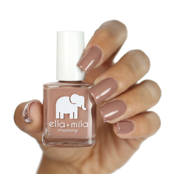 Cup O'Latte neutral brown nail polish manicure on a light skin tone with the bottle