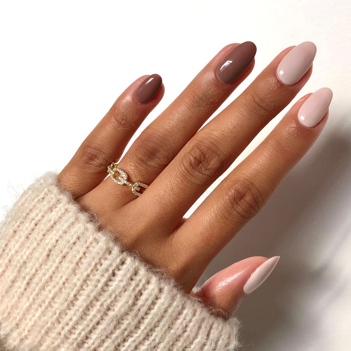 Cup O'Latte taupe brown nail polish manicure on a medium skin tone with a gold ring