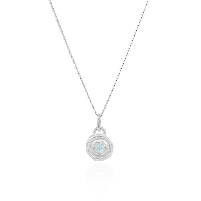 Silver necklace with a round pendant on a white background
