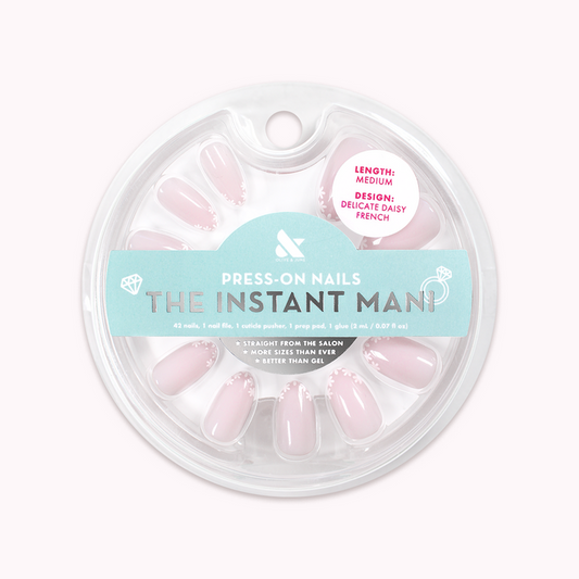 Delicate Daisy French - Press-On | Medium | Almond featuring sheer pink press-on nails with daisy French tip design for at-home mani