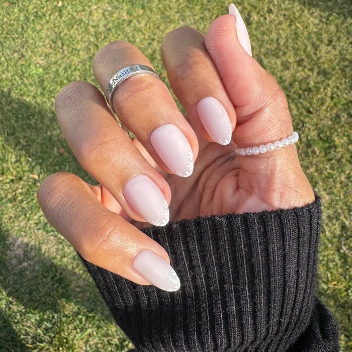 Delicate Daisy French - Press-On | Medium | Almond with sheer pink nails and small white daisy French tip design for quick mani