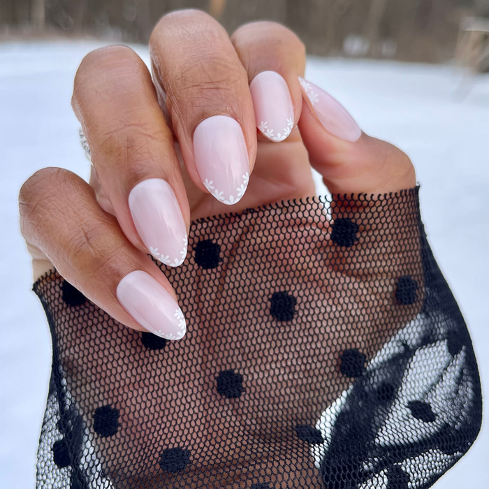 Delicate Daisy French - Press-On | Medium | Almond with sheer pink nails and small white daisy French tips for at-home mani