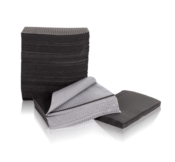 Stack of black disposable bibs on a white background