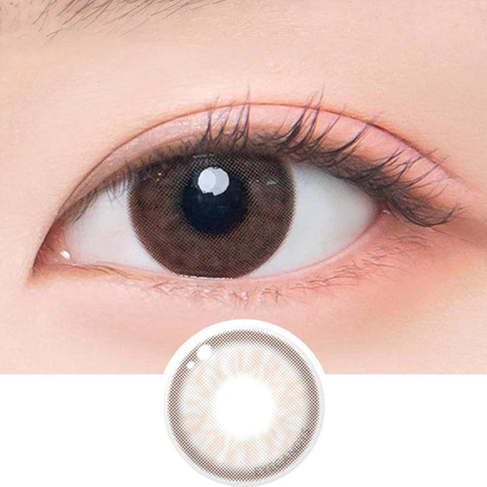 Macro shot of an eye wearing the DooNoon Epic 1-Day Grey (10pk) prescription colour contact lens, showing the multi-colored detail and natural effect on dark brown eyes, with clean eye makeup. At the bottom is the pattern of the colored lens design, showing the dotted detail and pigmentation.