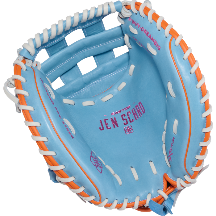 The Easton Jen Schro MYWHY 33" Fastpitch Catcher's Mitt (MYWHY-DREAMBIG) is a light blue catcher's mitt with white and orange laces, and "EASTON JEN SCHRO" printed in pink on the palm.
