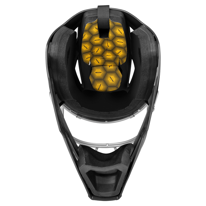 A top-down view of the interior of a black Easton Phenom Catcher’s Helmet (model: PHENOMCH) displays yellow honeycomb padding and black foam cushioning designed for superior head protection—an essential feature in high-quality baseball catcher’s gear from Easton.