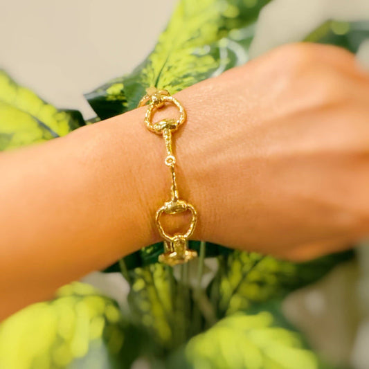 Silver equestrian linked bracelet by Ellison+Young featuring horse-themed charms on a delicate chain.