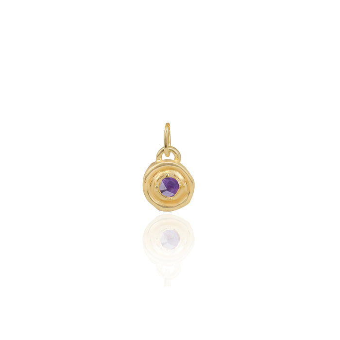 Gold pendant with a purple gemstone on a white background