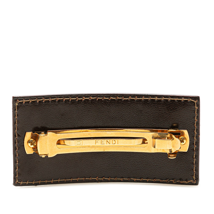 Fendi Zucca canvas barrette hair clip with signature monogram pattern, designed as an elegant hair accessory.