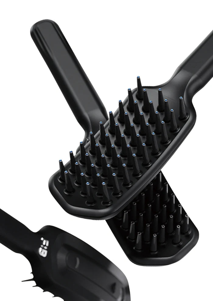 Black hairbrush with bristle design on a white background
