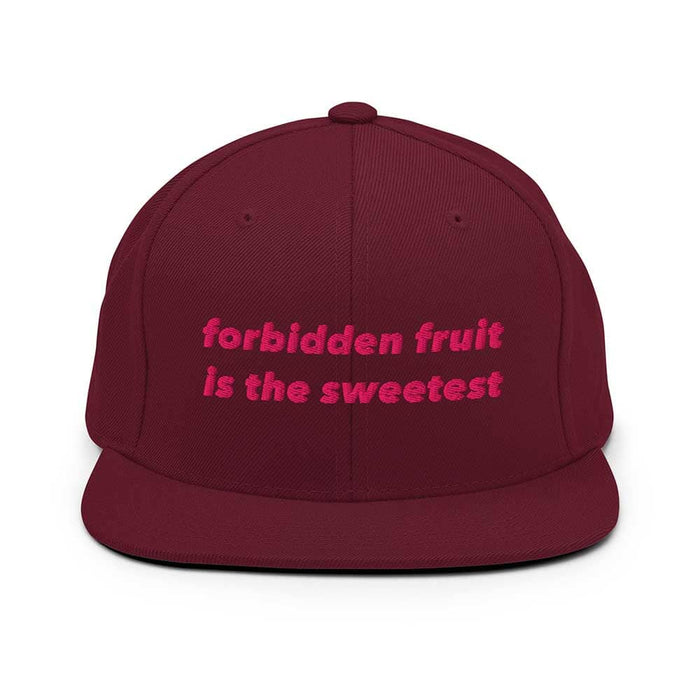 Maroon flatbill cap with pink text 'forbidden fruit is the sweetest' on a white background