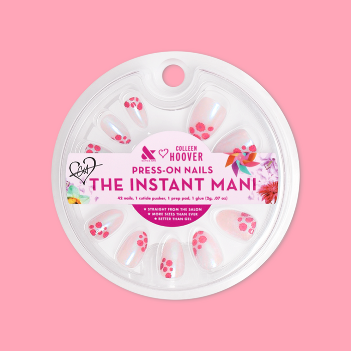 Fuchsia Florals - Press-On | Short | Almond showing short almond press-on nails with pink floral design in round clear packaging