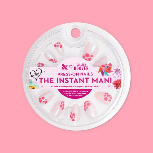 Fuchsia Florals - Press-On | Short | Almond showing short almond press-on nails with pink floral design in round clear packaging
