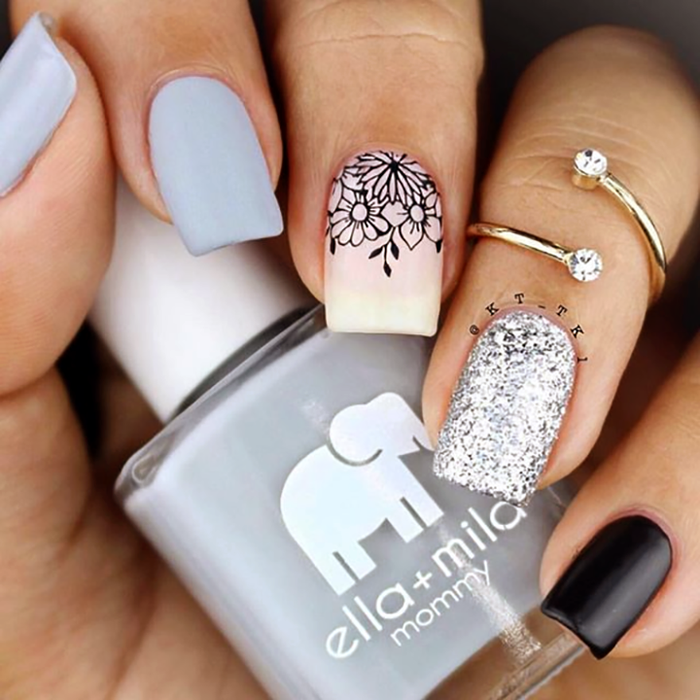 Grey Skies grey nail polish with white henna, glitter and black accent nails
