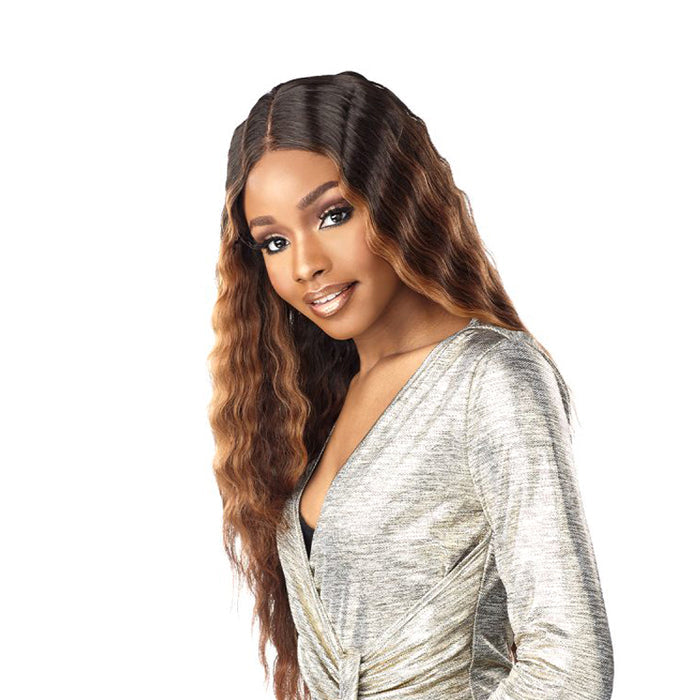 SENSATIONNEL Butta Lace Unit 17 wig long wavy brown ombre with center part on model in silver dress