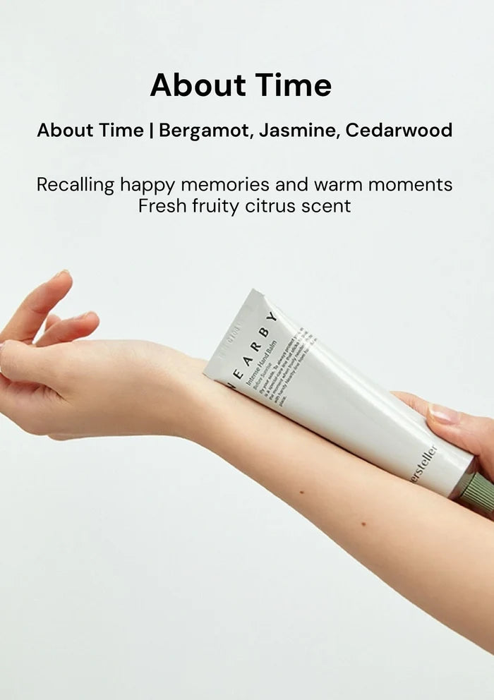 Person applying a tube of 'About Time' fragrance on their arm with product description text above.