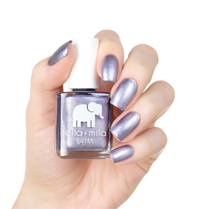 Icy Attitude purple metallic nail polish manicure on a light skin tone with the bottle