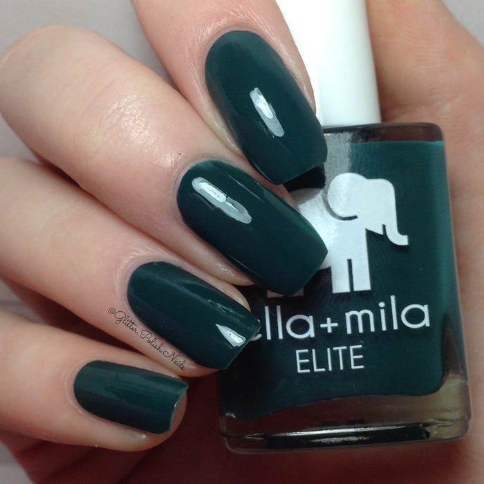 Island Hopping deep sea green nail polish close-up with the bottle