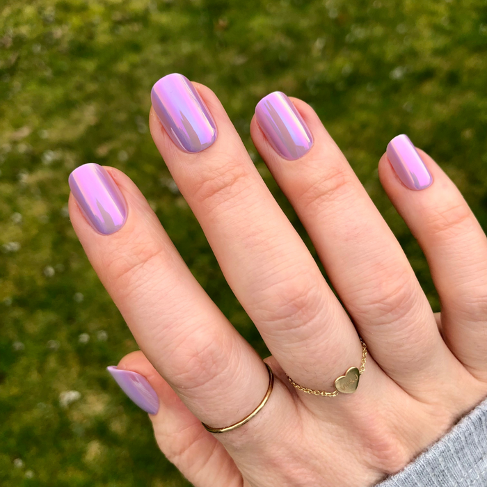 Lavender Chrome - Press-On | Short | Squoval showing short squoval press-on nails with shiny lavender chrome polish on natural hand