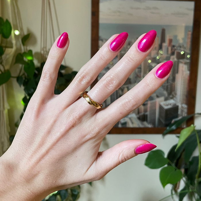 Lily Blooms shimmering bold magenta gel polish on natural nails for a glossy, long-lasting at-home manicure by Olive and June