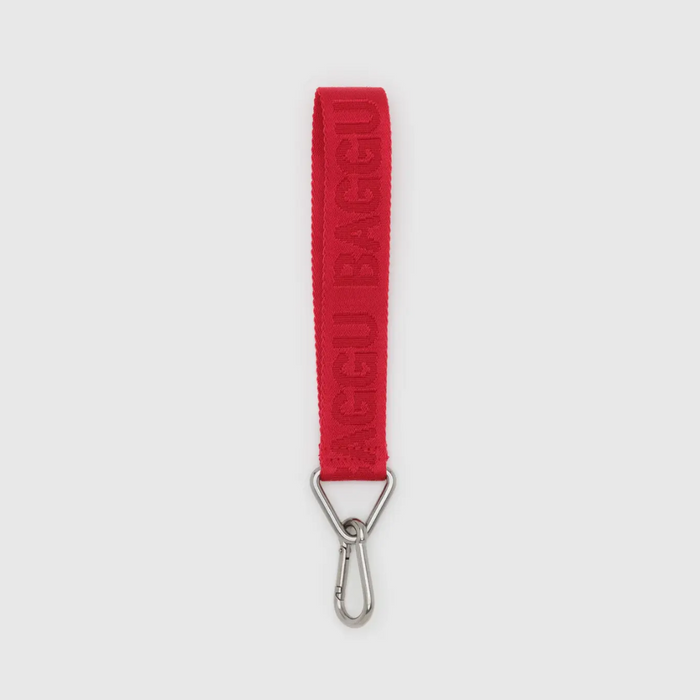 Red BAGGU logo keychain with embossed text and silver metal clasp