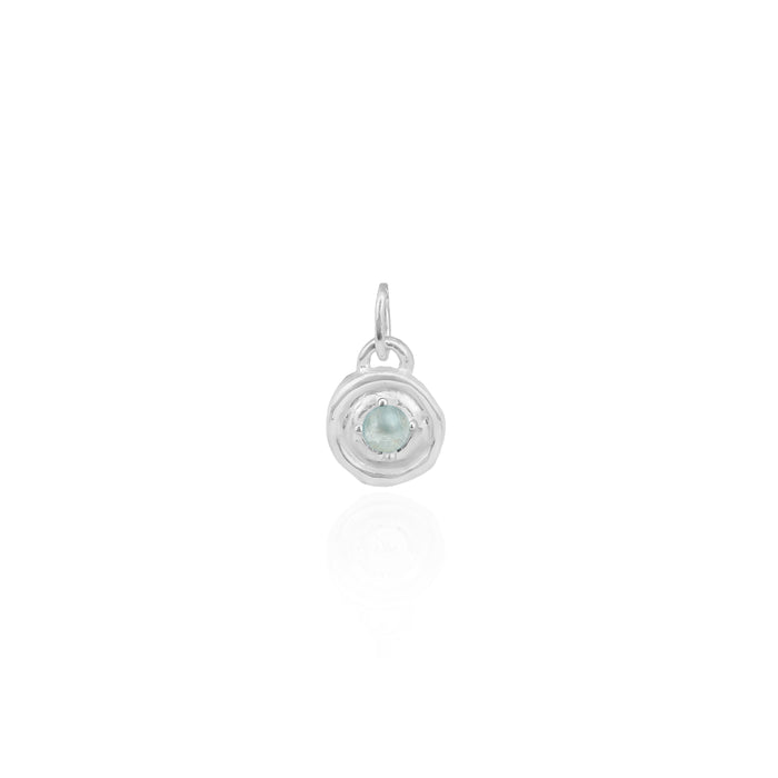 Silver pendant with a light blue gemstone on a white background