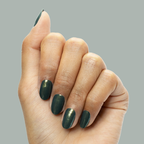 Hand showing short nails painted in Martini Chrome gel polish with deep olive green and golden shimmer manicure
