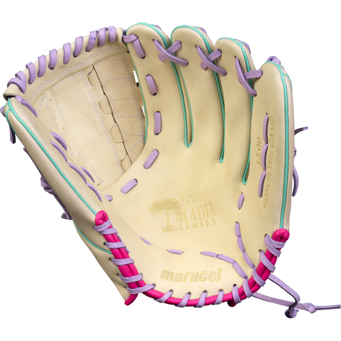The Marucci Acadia 45K9 12″ Fastpitch Glove (MFG4ACFP45K9-CM/LP) is a cream-colored glove crafted from full-grain cowhide leather, accented with purple, pink, and teal laces, and featuring Acadia Series and Marucci branding on the palm.