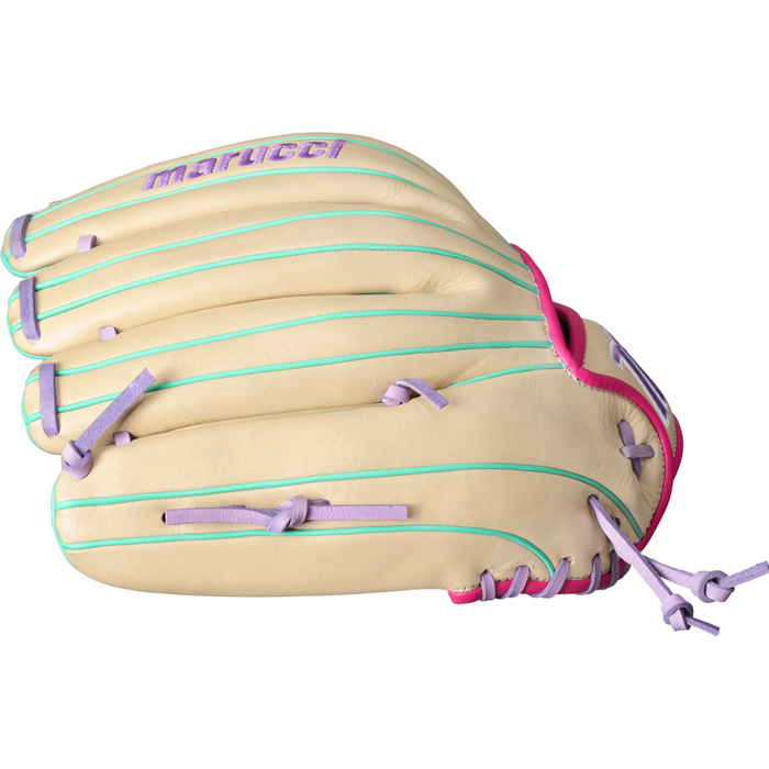 The Marucci Acadia 47A3 12.5″ Fastpitch Glove (MFG4ACFP47A3-CM/LP) is crafted from full-grain cowhide leather and showcases a tan base accented by pastel purple laces, mint green stitching, and pink trim. The Marucci name is embroidered in purple on the back of the glove.